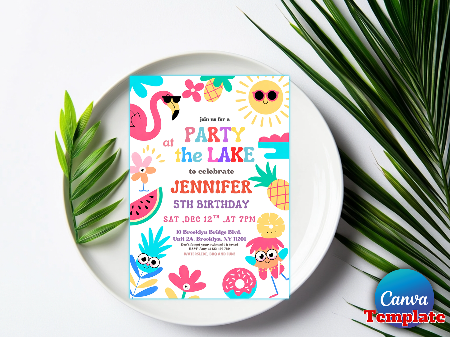 A colorful tropical-themed birthday invitation card displayed on a white plate, surrounded by green palm leaves on a white background. The card features illustrations of flamingos, pineapples, watermelons, and a sun with the text 'Join us for a PARTY at the LAKE to celebrate JENNIFER 5TH BIRTHDAY'.