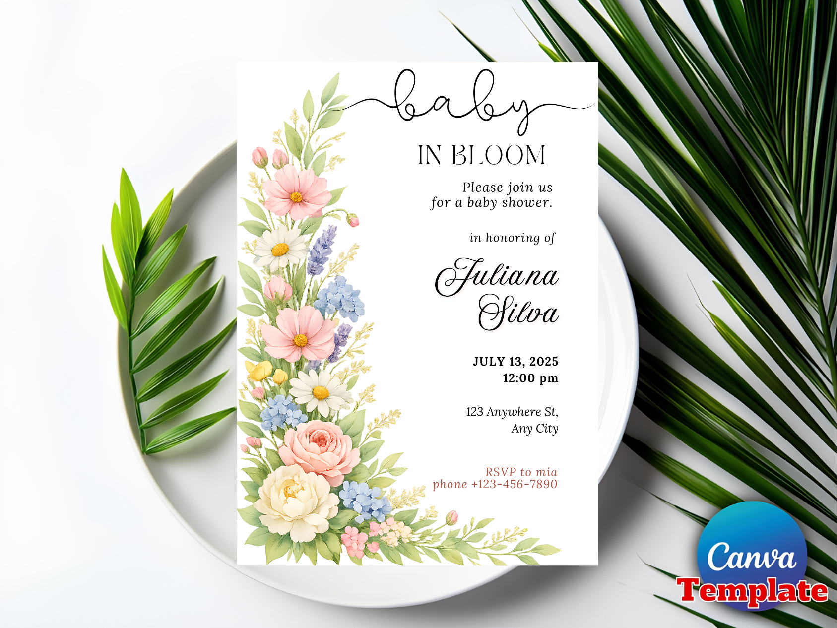 Baby in bloom invitation flat lay on white plate with palm leaf