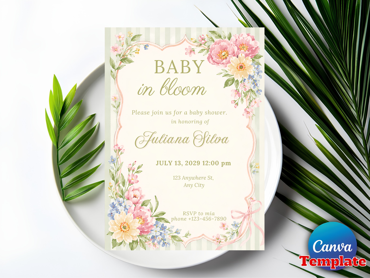 Baby in bloom invitation flat lay on white plate with palm leaf