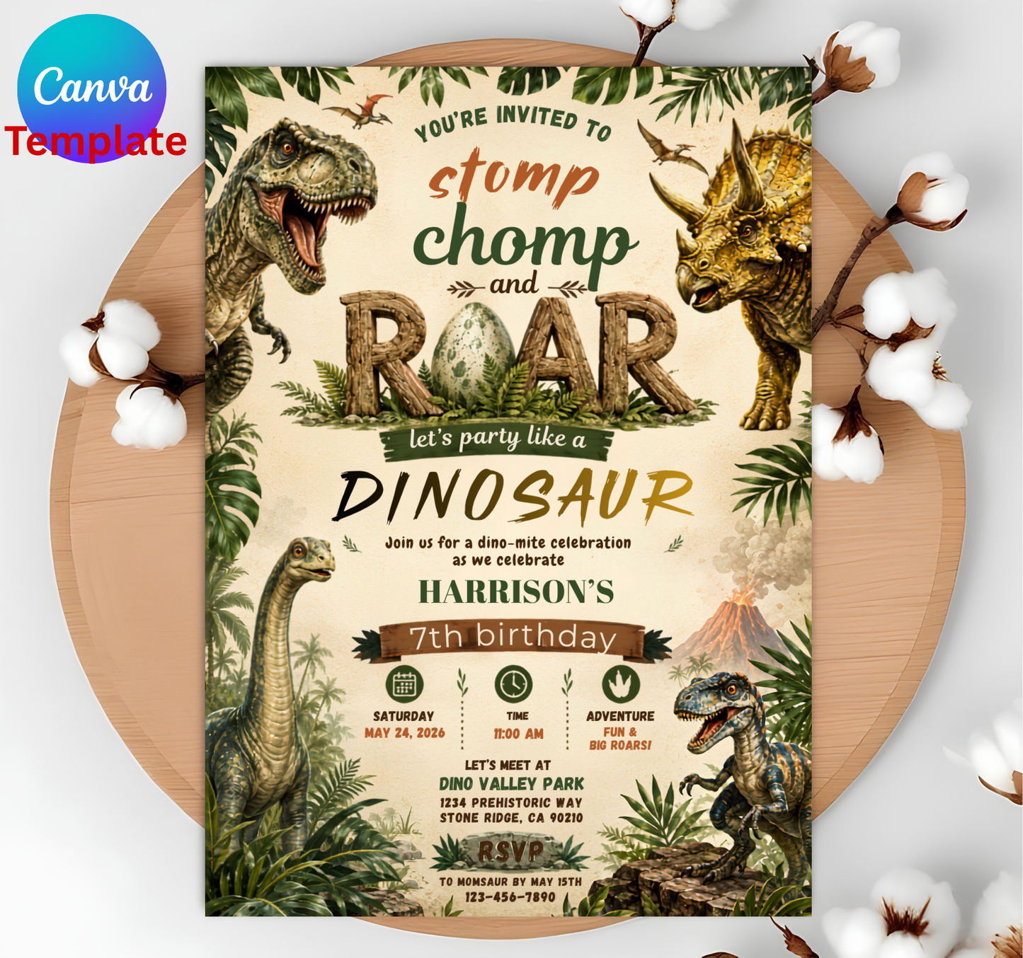 A dinosaur-themed birthday invitation card displayed flat on a round wooden board with cotton bolls around it. The card features illustrated dinosaurs, palm leaves, and jungle-style graphics in beige, green, brown, and black tones.