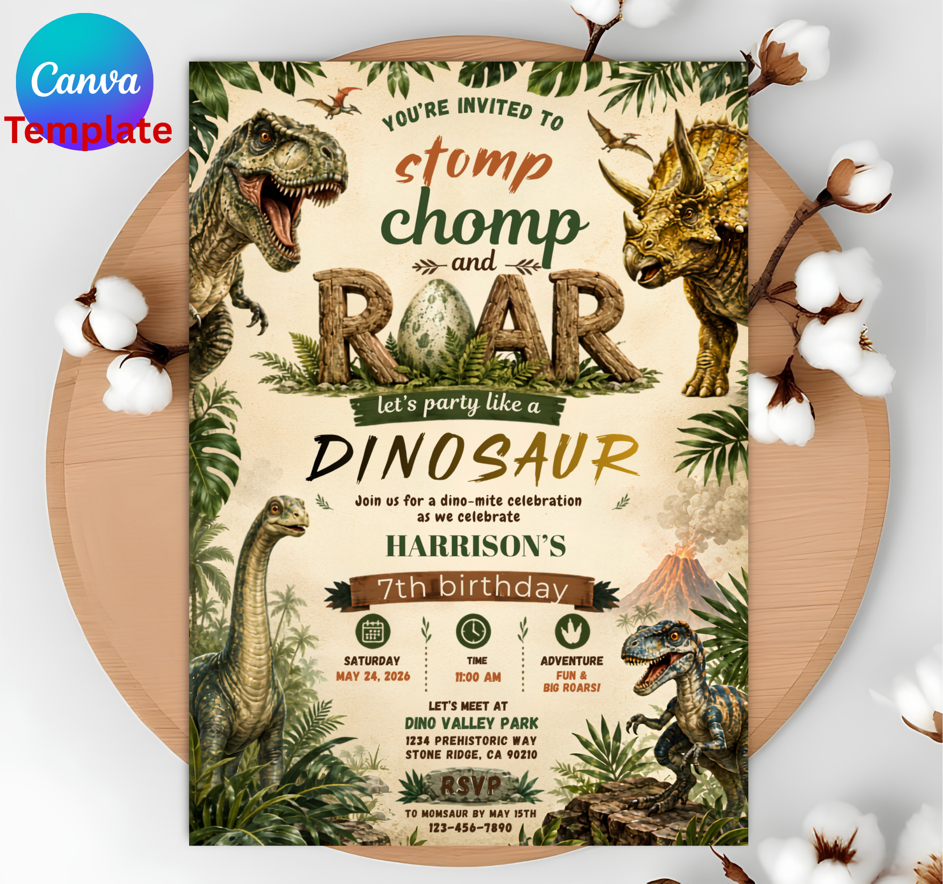 A dinosaur-themed birthday invitation card displayed flat on a round wooden board with cotton bolls around it. The card features illustrated dinosaurs, palm leaves, and jungle-style graphics in beige, green, brown, and black tones.